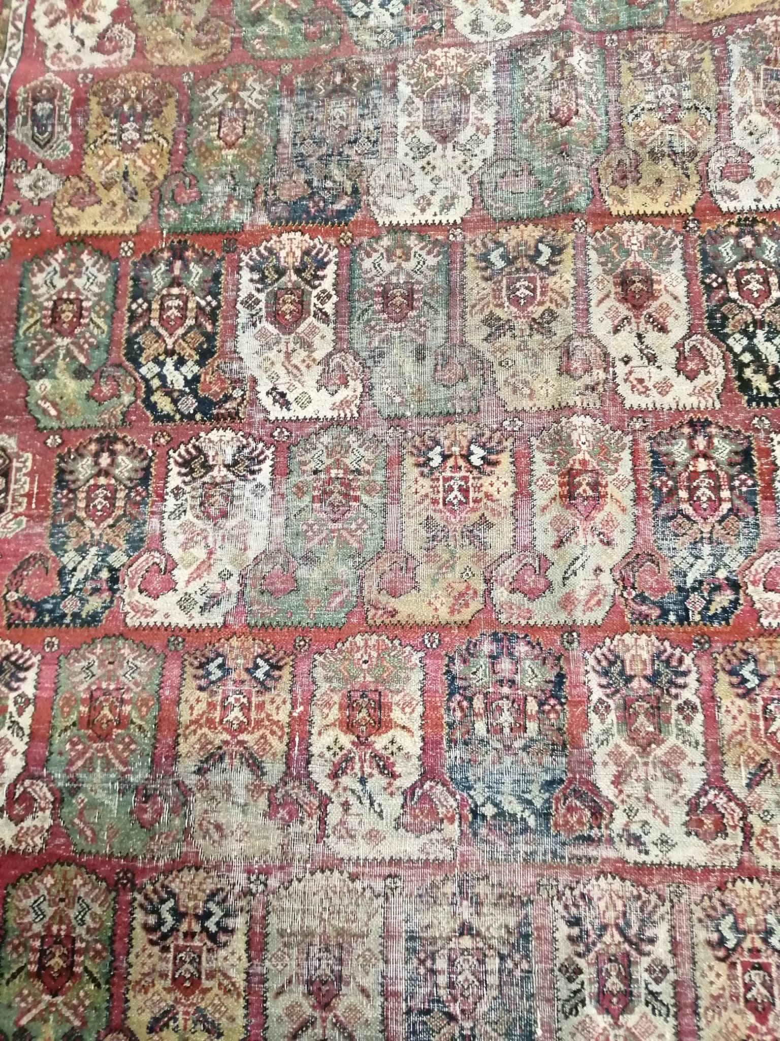 An antique Agra rug 210 x 124cm